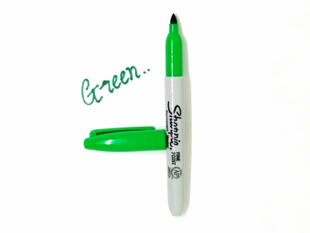 Green marker pen on isolated white background. Greenmarker pen that used to draw on presentation paper.のeditorial素材
