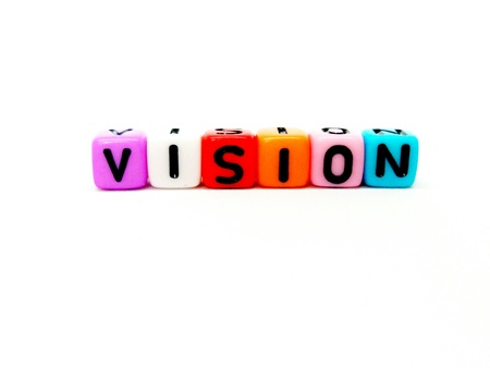VISION word of colourful cube alphabet with isolated white background.の写真素材