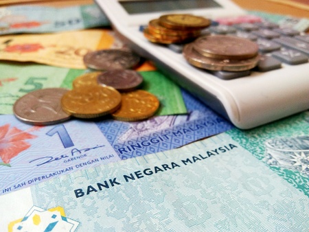 Ringgit Malaysia bank notes with calculator. Malaysia currency.