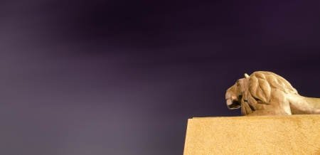 Lion statue with dramatic skyの写真素材