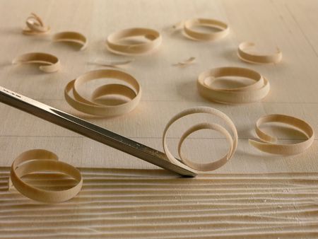 woodcarving tool and wood shavings       