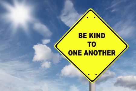 Be kind to one another yellow road signの写真素材