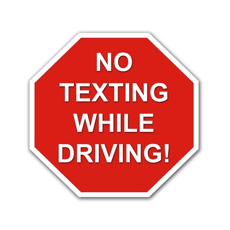 Red No Texting While Driving stop sign on a white backgroundの写真素材