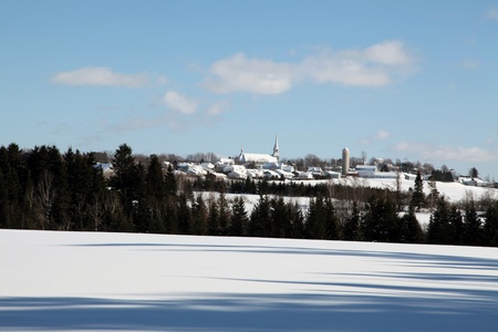 Small country town at a distance on a beautiful winter dayの写真素材