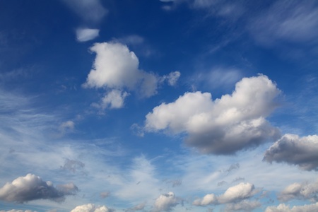 Fluffy clouds against a beautiful blue skyの写真素材