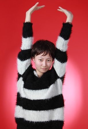 A Beautiful Chinese girl Isolated On red の写真素材