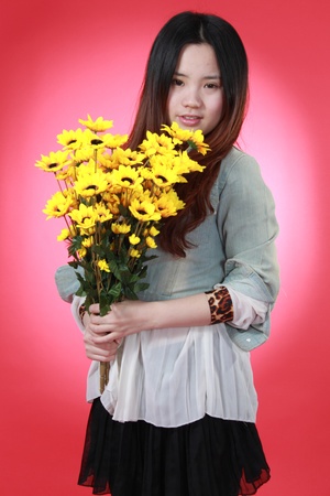 A Beautiful Chinese girl with many flowers.の写真素材