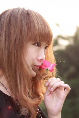 A lovely asian woman in a parkの写真素材