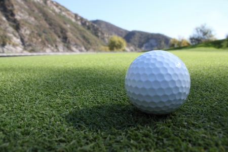 Golf ball on the sodの写真素材