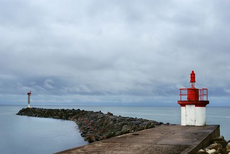 Jetty with lighthouse at La Cotiniere on Oleron island (France).の写真素材