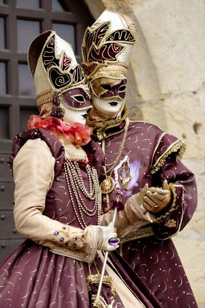 Match costumes for a couple of masks under a medieval scenery (Annecy/France)の写真素材