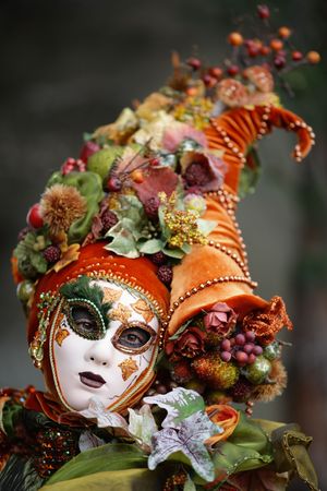 Woman disguised with a horn of plenty mask (Annecy/france)の写真素材
