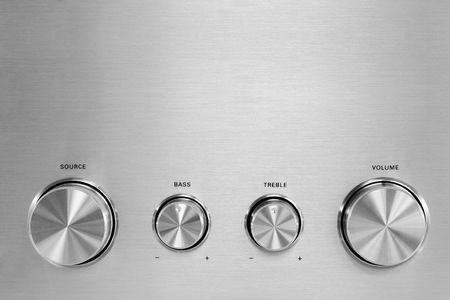 Four isolated gray hifi knobs from a stereo amplifierの写真素材