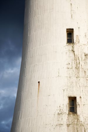 White tower facade under a stormy weatherの写真素材