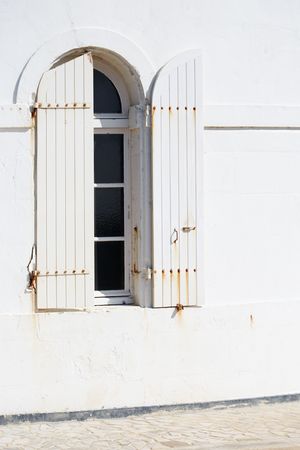 White shutters and wall under bright lightの写真素材