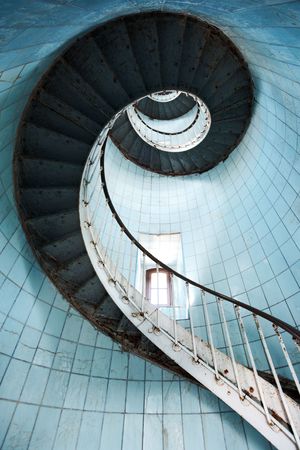 View from beneath of a spiral staircase (Charente Maritime / France)の写真素材
