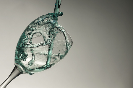 blue water splash on a glasの写真素材