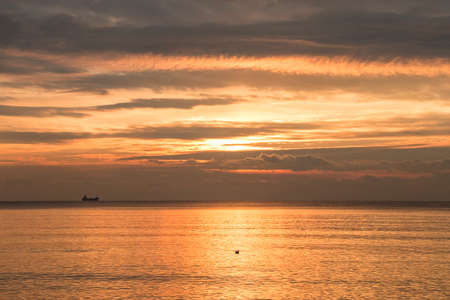 Welcoming the sunrise on the Black Sea coast early in the morningの写真素材