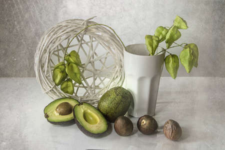 still life with sliced avocado on white background close upの写真素材