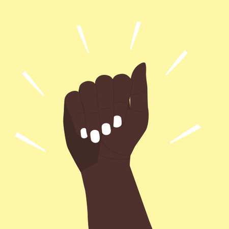 The dark-skinned hand is raised up. The hand is clenched into a fist in protest. A symbol of the African, African American peace movement for empowerment. Vector illustration. Hand isolated on yellowのイラスト素材