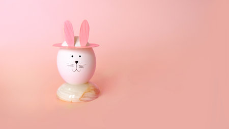 easter eggs with rabbit ears on pink backgroundの写真素材