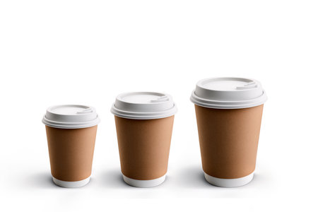 Takeaway coffee cups in diffrent sizes. Isolated on white backgroundの写真素材