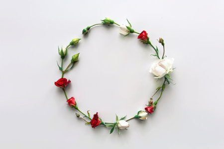 Flowers composition. Wreath made of pink rose flowers on white background. Flat lay, top view, copy space.の写真素材