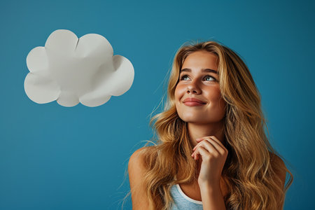 thinking young lady standing over blue background.の素材