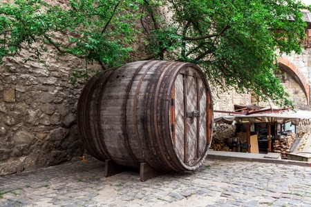 Big wine barrel on the street of Lvivの写真素材