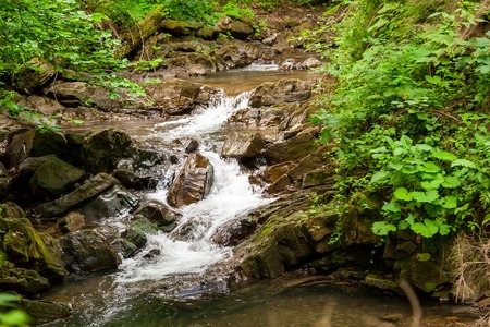 Small waterfall in Carpathan mountains in Ukraineの写真素材