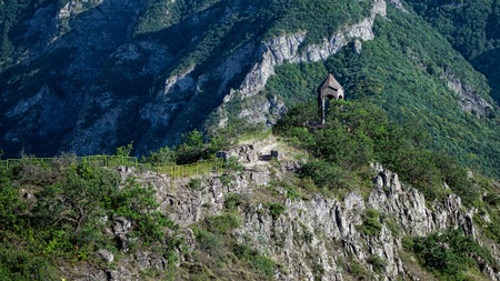 Small chapel with mountains in the background, Armenia, Tatevの写真素材