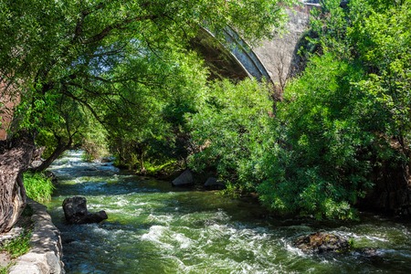 Under Ashtarak bridge in Armenia. River in forestの写真素材
