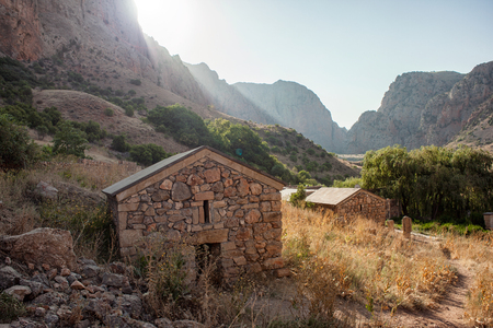 Beautiful ancient armenian monastery between the mountains and red cliffs Noravankの写真素材