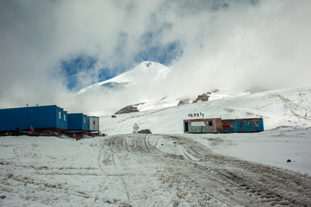 High-mountain camp near Elbrus peak in cloudsの写真素材