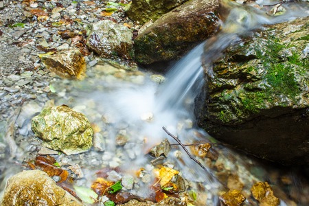 Small source of water in the rocks. Picture with a long exposureの写真素材