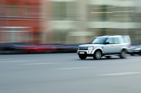 Fast driving car in the motion blurの写真素材