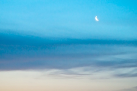 beautiful landscape with a crescent moon before sunrise の写真素材