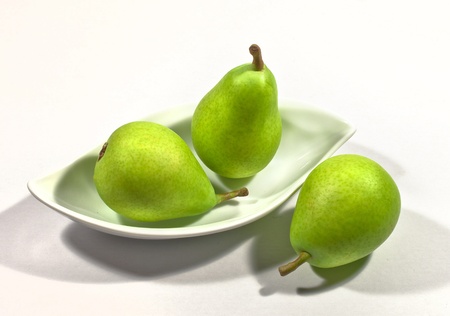 pear green on a white plateの写真素材