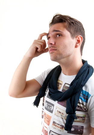 Portrait of young man thinking - Isolated against whiteの写真素材