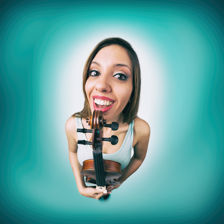 Funny happy woman with violinの写真素材