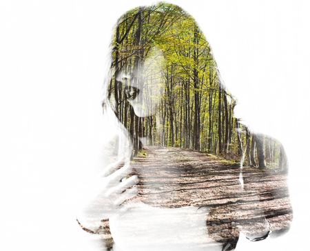 Portrait of a young woman with the effect of double exposure, nature style