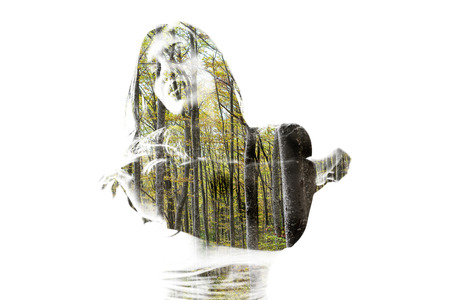 Portrait of a young woman with the effect of double exposure, nature styleの写真素材