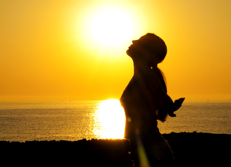 A beautiful girl silhouette free in the sunの写真素材