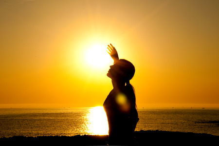 A beautiful girl silhouette free in the sunの写真素材
