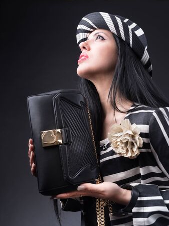 Style girl with bag and black and white outfitの写真素材