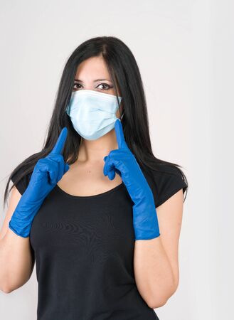 Woman recommends what to wear for prevention, gloves and maskの写真素材