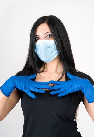 Woman recommends what to wear for prevention, gloves and maskの写真素材