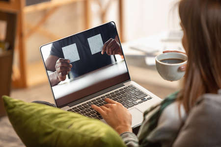 Woman working from home during coronavirus or COVID-19 quarantine.の写真素材