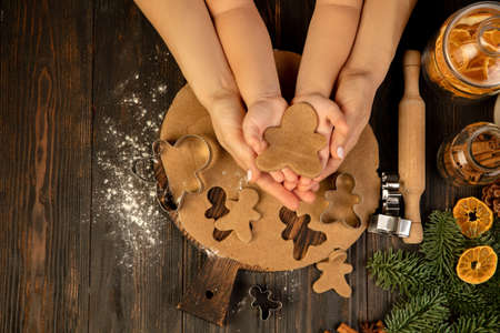 Christmas gingerbread man in child hands. Holiday, family, home comfort.の写真素材