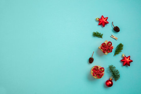 Holiday decorations on blue background top view. Christmas greeting card.の写真素材